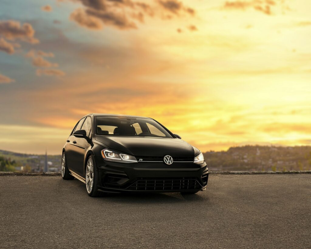 Black Volkswagen Golf R at sunset